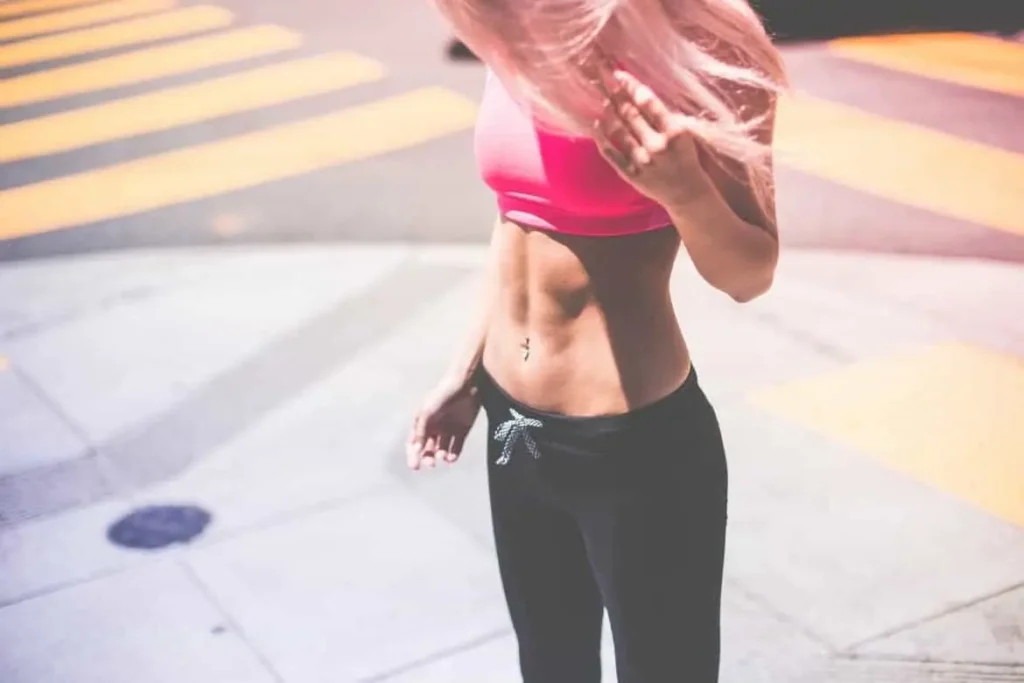 Woman with toned stomach after LA-EMS Body Sculpting Treatment Oakham